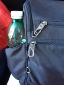 Easy to wipe exterior, latching closures and zip out water bottle pocket.